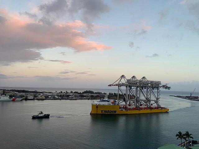 Sand Island cranes pulled into Honolulu Harbor by tug